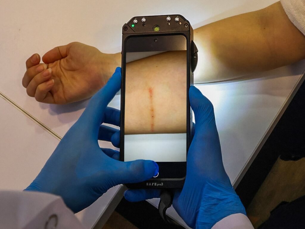 Detailed forensic examination of crime scene evidence using the SAFE PRO 3 multispectral light source to reveal hidden biological traces.