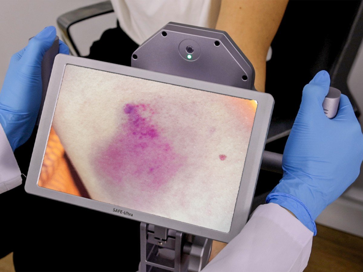 Laboratory analysis of questioned documents and fiber evidence using the SAFE ULTRA wide-spectrum forensic imaging system for high-contrast visualization.