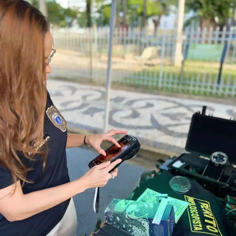Pernambuco Civil Police specialist examining forensic evidence at a crime scene with a ForenScope device