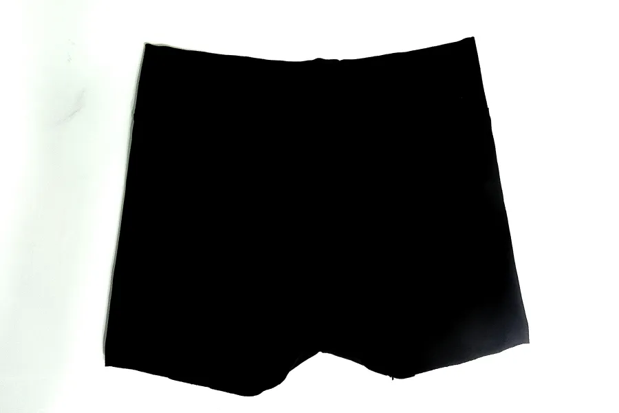 Naked-eye view of black shorts examined for the presence of blood stains during forensic analysis.