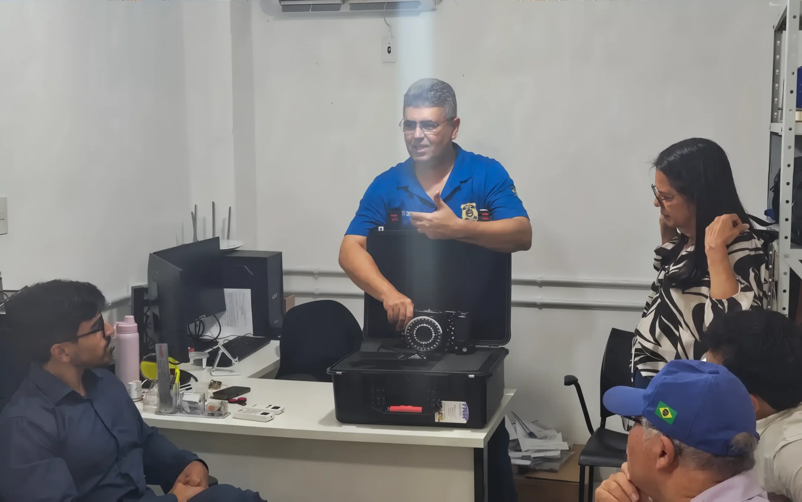 Forensic experts from the Scientific Police of Alagoas, Brazil, attending a hands-on training session featuring the ForenScope 8K Android forensic imaging system.